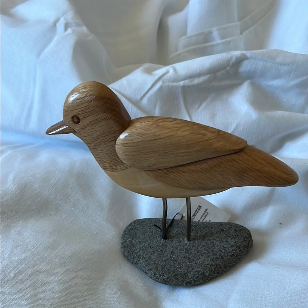 Light Brown Wooden Bird Toy with Detailed Carving and Metal Legs