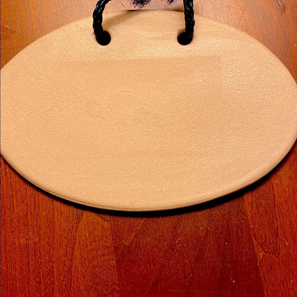 “Knit Happens” Hanging Plaque by Mountain Meadows Pottery. Features Yarn/Needles