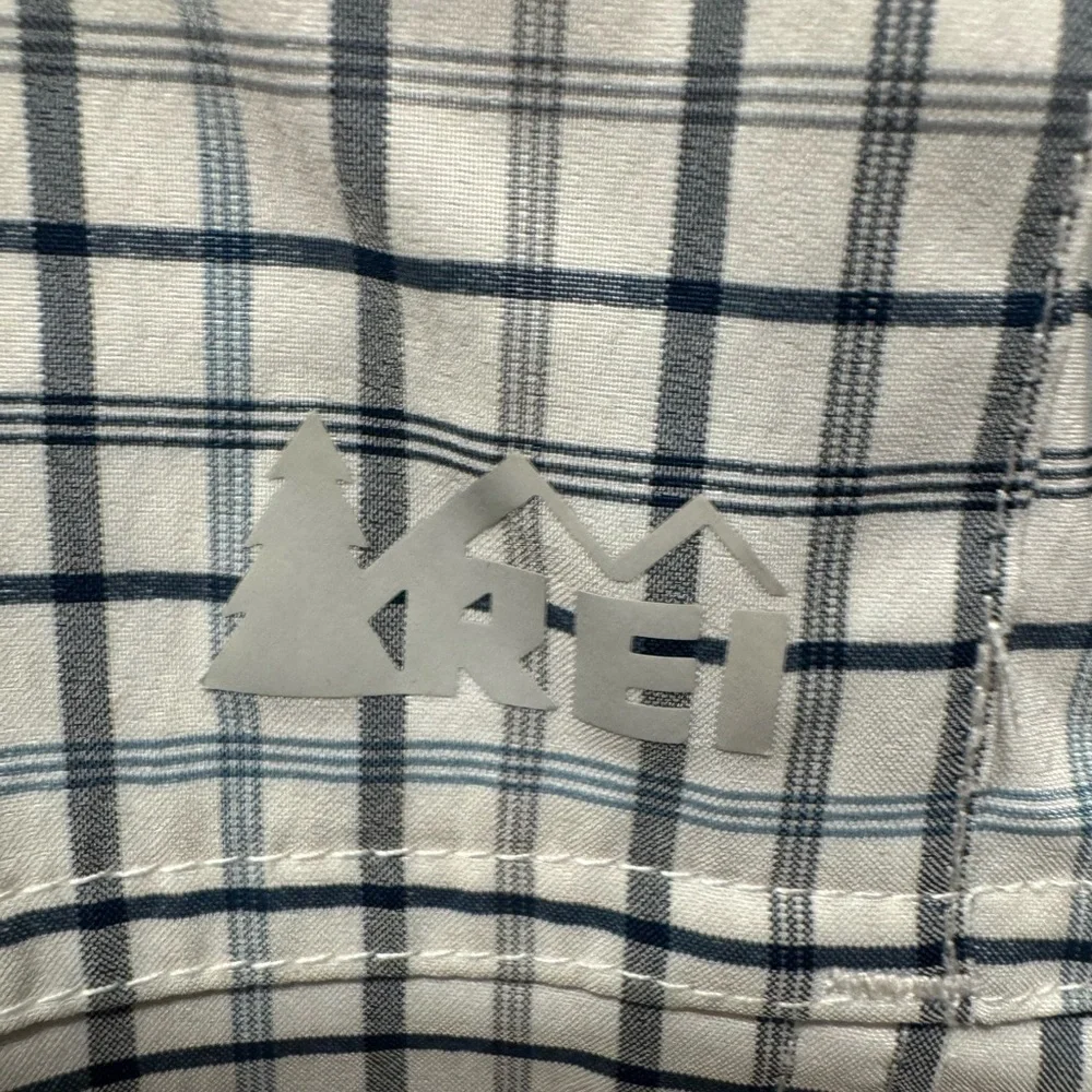 REI this button