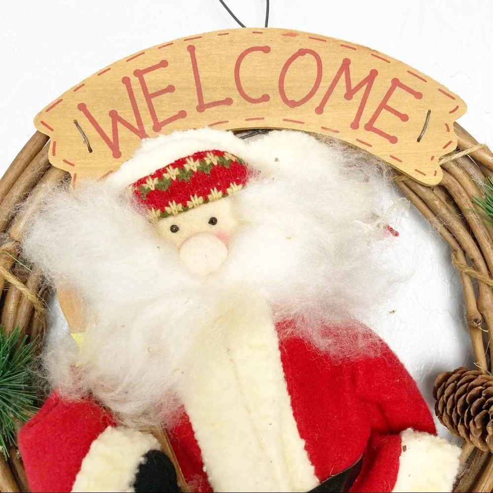 Christmas wreath with stuffed Santa Claus