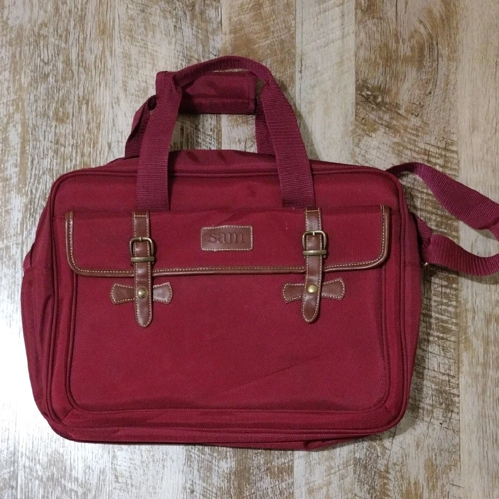 Red Laptop Bag with Adjustable Strap and Brown Leather Accents