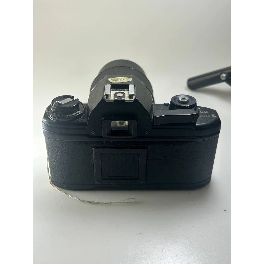 UNTESTED AS IS Nikon EM 35mm SLR Film Camera with Aetna Rokunar YS 135mm f/2.8 L