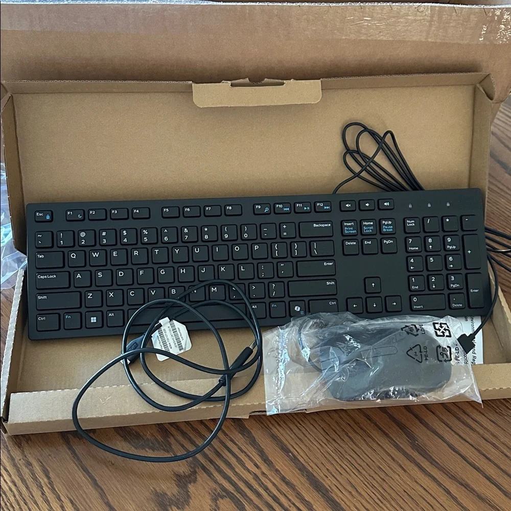 Dell Black Wired Keyboard with USB Connection and plugin mouse.