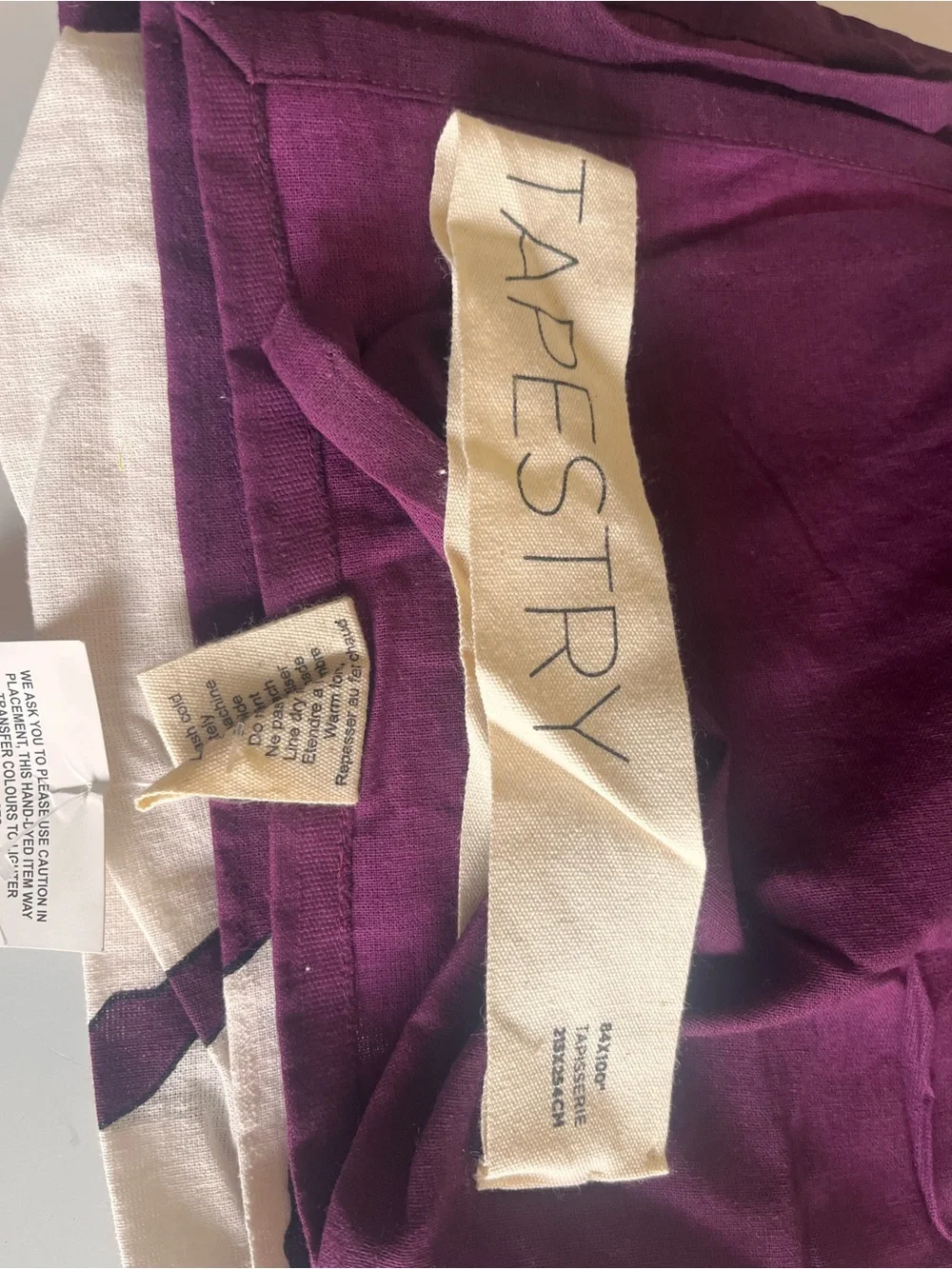 Urban Outfitters fabric tag cream