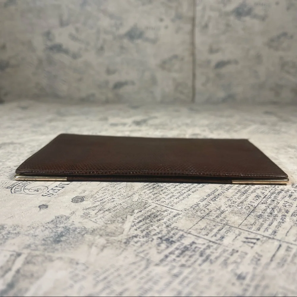 Smythson Antique lizard skin passport wallet with gold corners