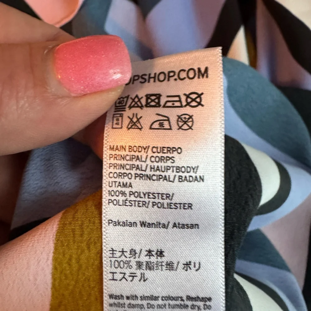 Topshop tags laying art