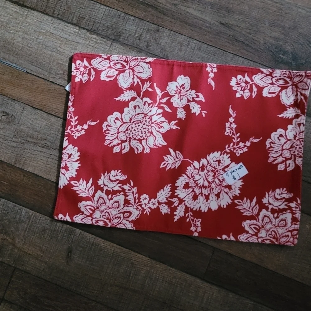 2 red and white place mats.