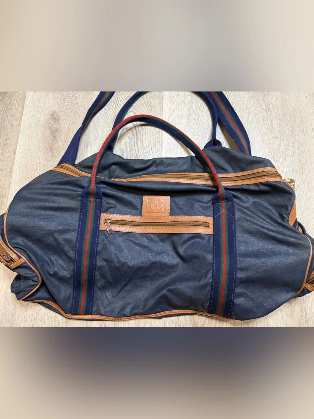 Gucci accents carrying webbing