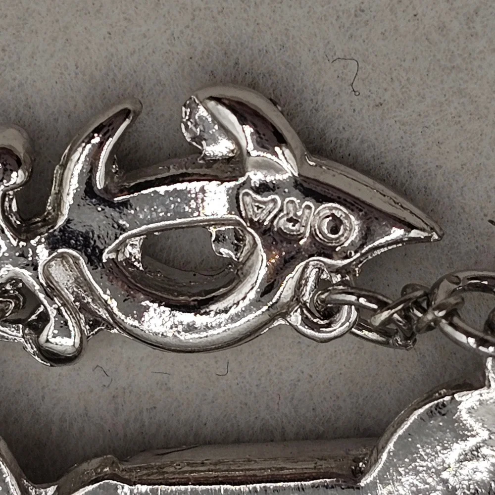 Ora motorcycle brooch