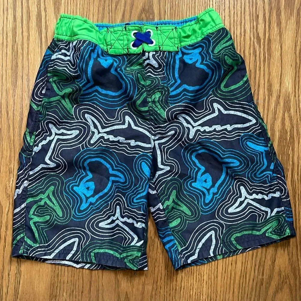 Cherokee swimming shorts. Drawstring waist. Size medium (10/12). Pockets.
