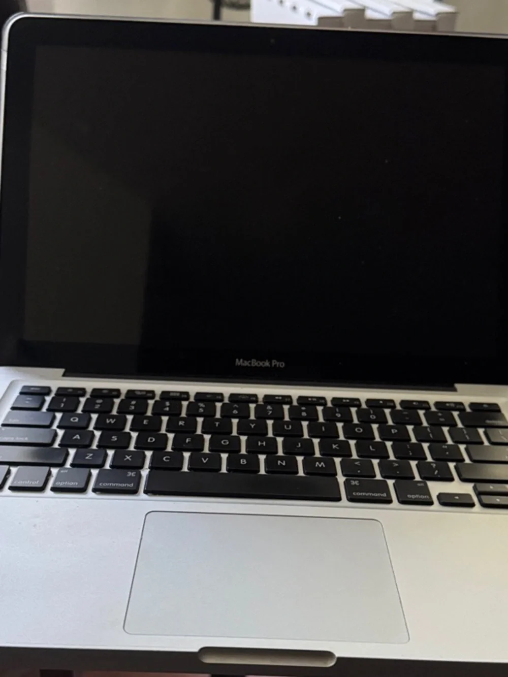 Apple MacBook Pro Silver with Black Keyboard. Untested As-is needs repair.