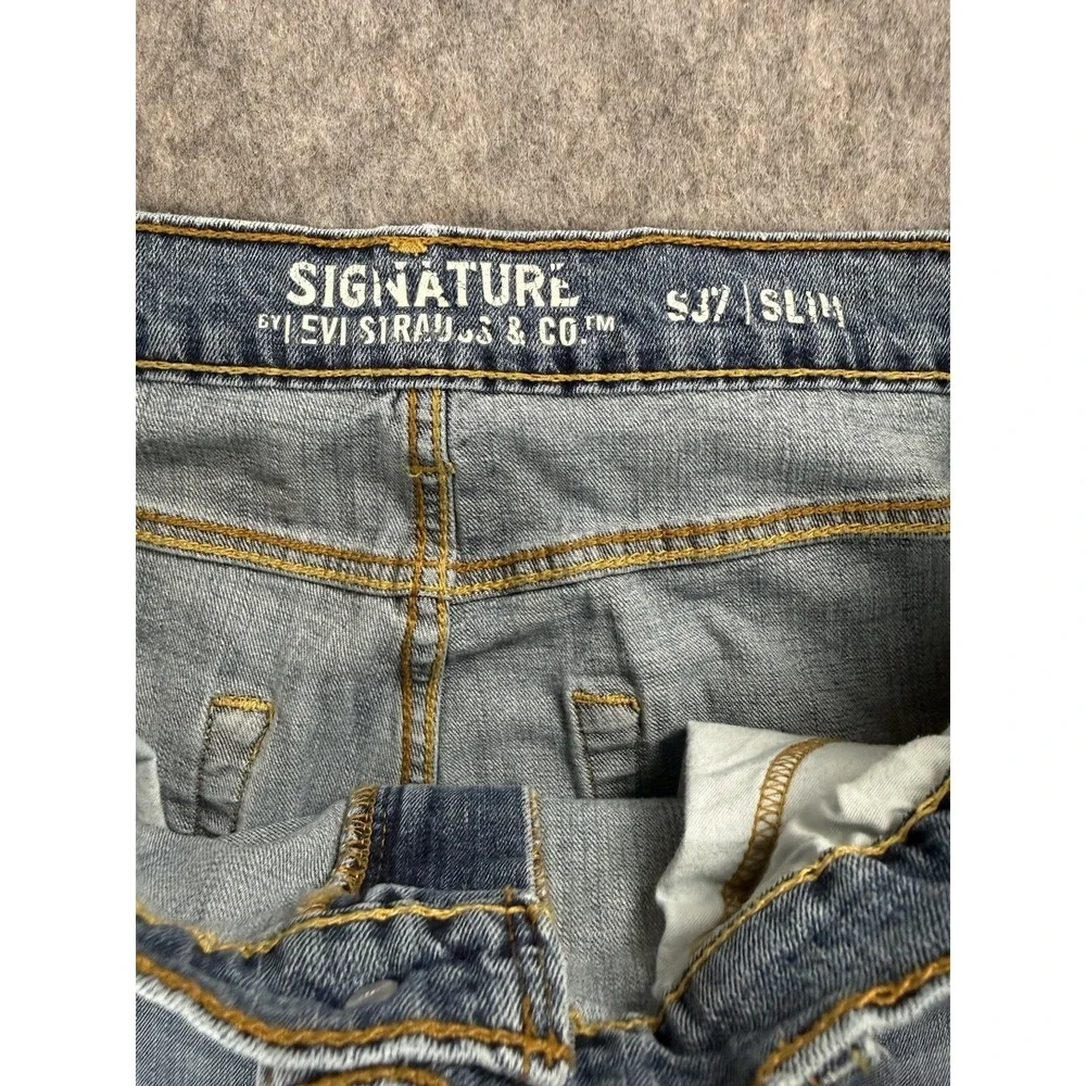 Signature by Levi Strauss button are