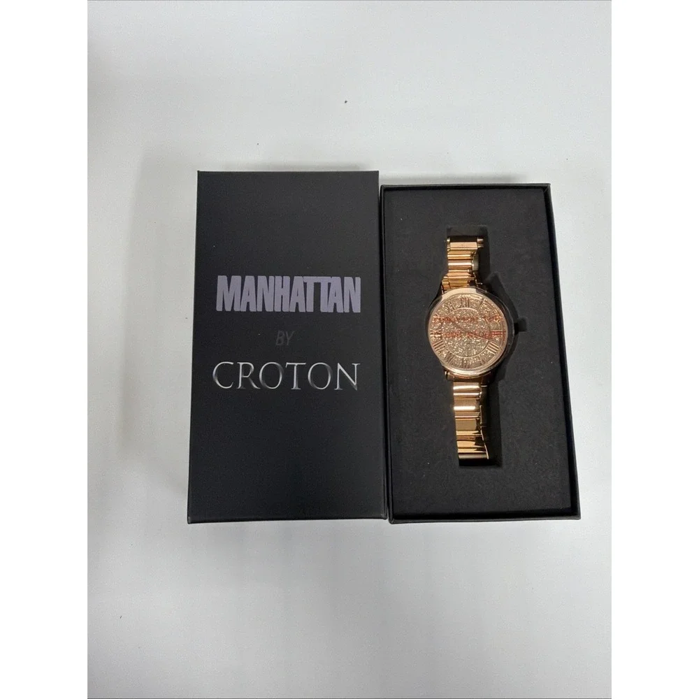 Croton Manhattan watch features a gold-tone design