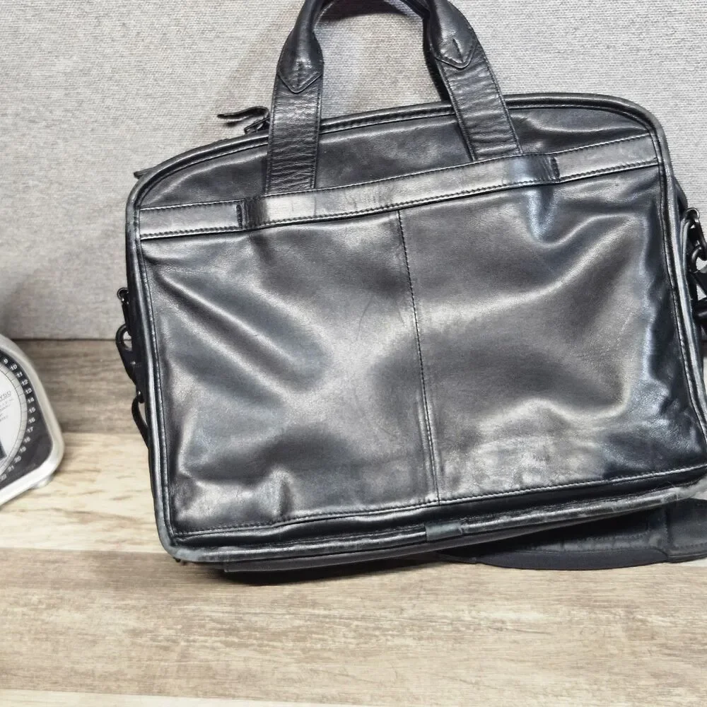 Tumi black leather
