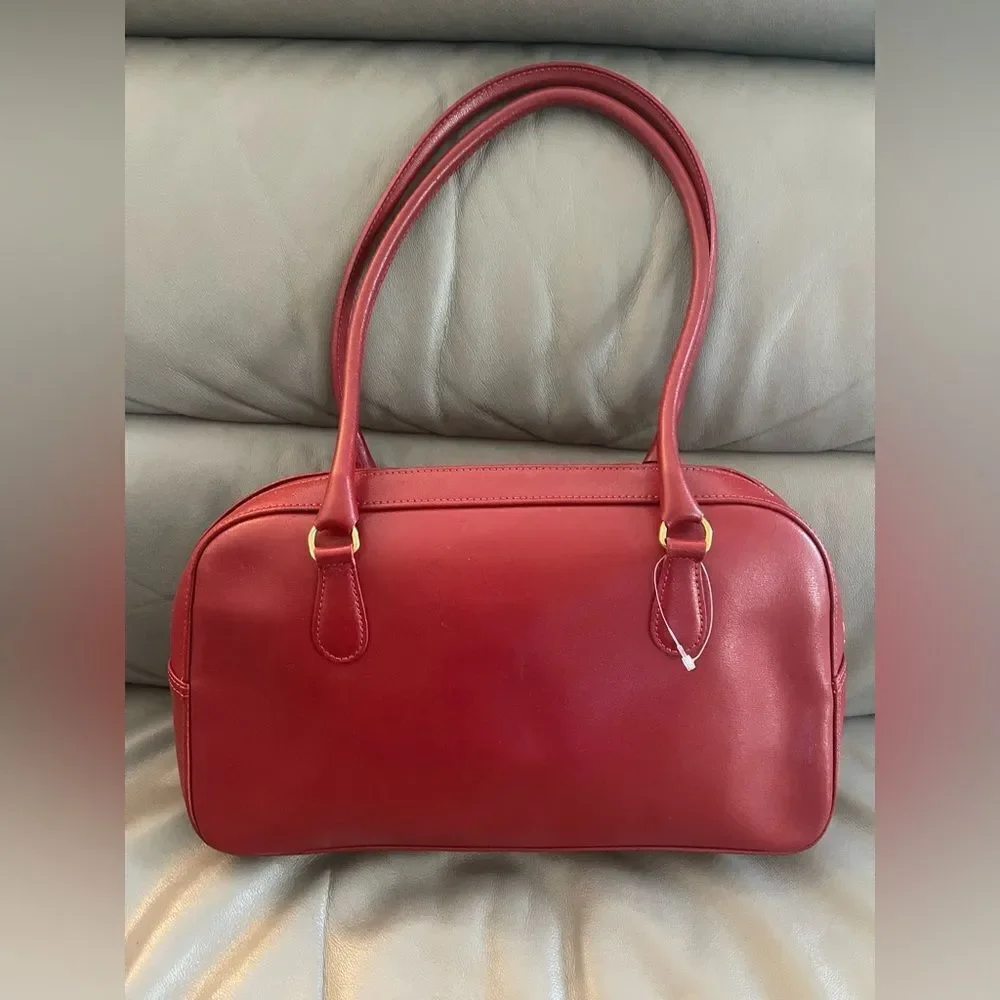 Vintage Longchamp Roseau Leather Bag in the color Bordeaux.