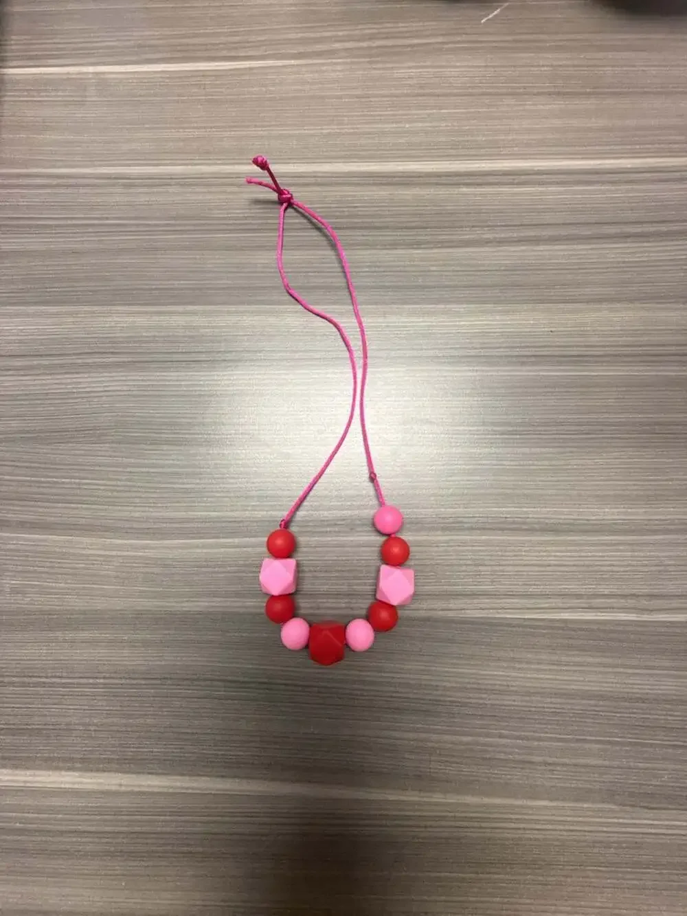 Silicone Teething Sensory Chew Necklace in Pink and Red
