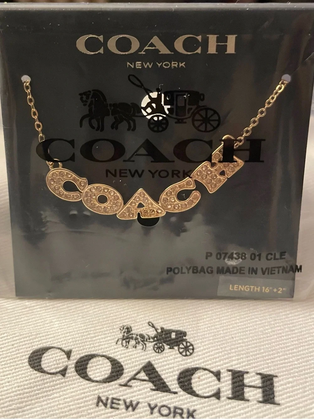 Coach gold tone