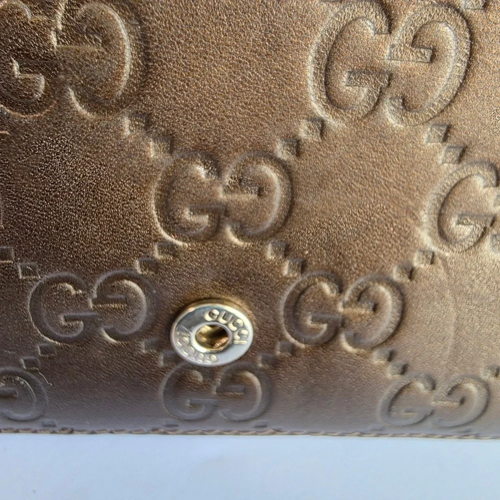 Gucci Embossed Brown Leather Wallet
