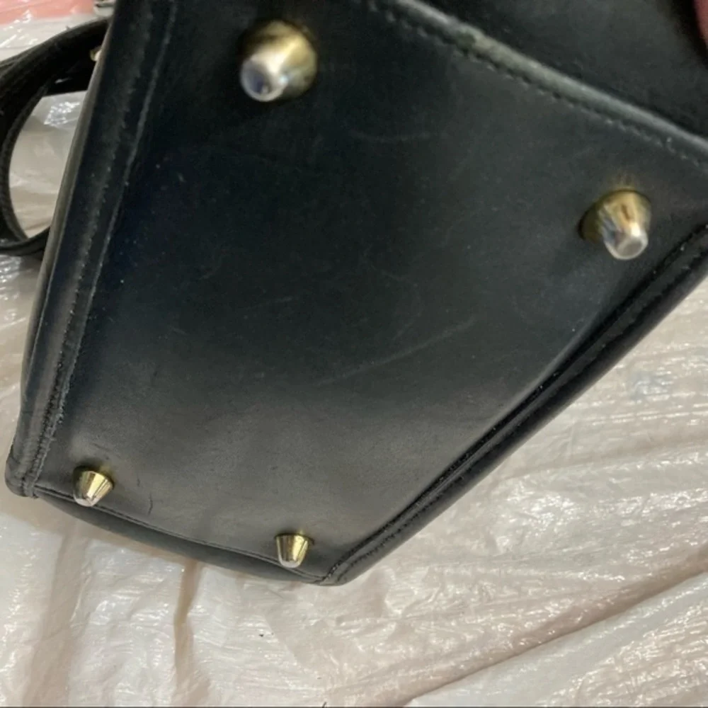 Coach scuffs scratched