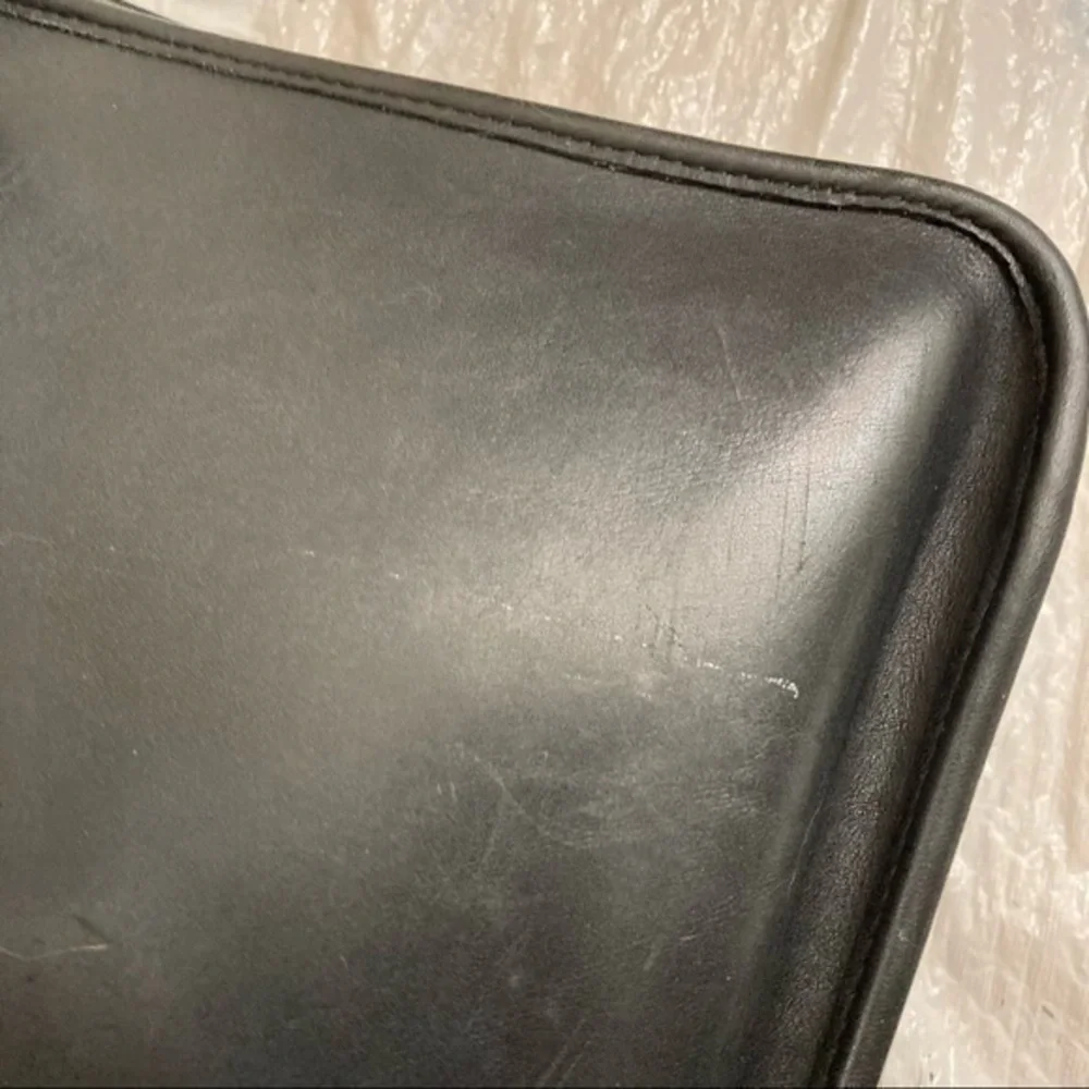 Coach scuffs scratched