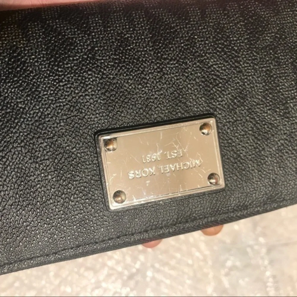 Michael Kors missing wristlet