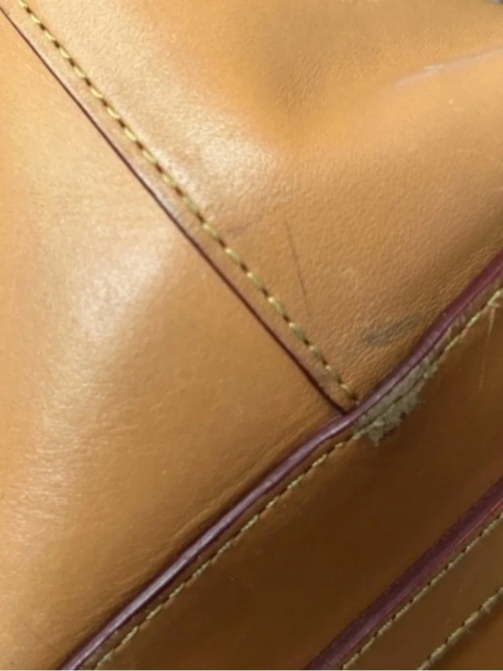 Dooney & Bourke Tan Drawstring Leather Serena  with Red Trim and Tassel