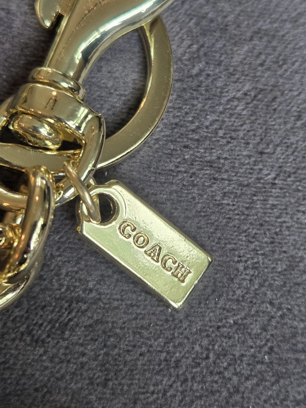 Coach gold tone