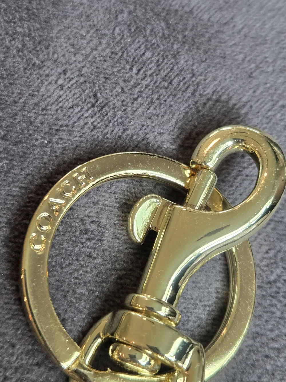 Coach gold tone