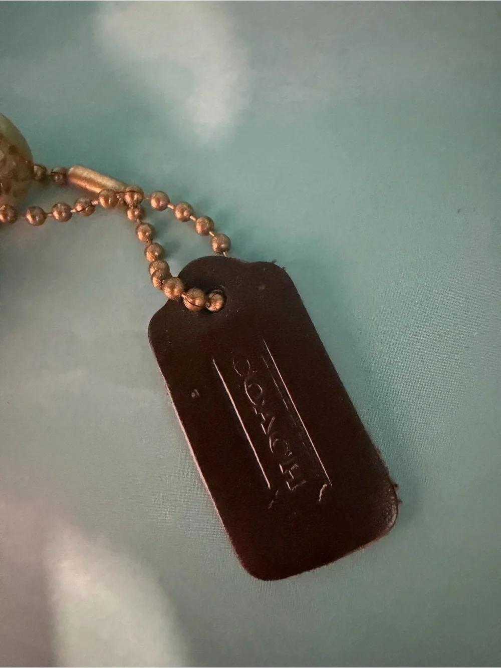 Coach underside tone minimal