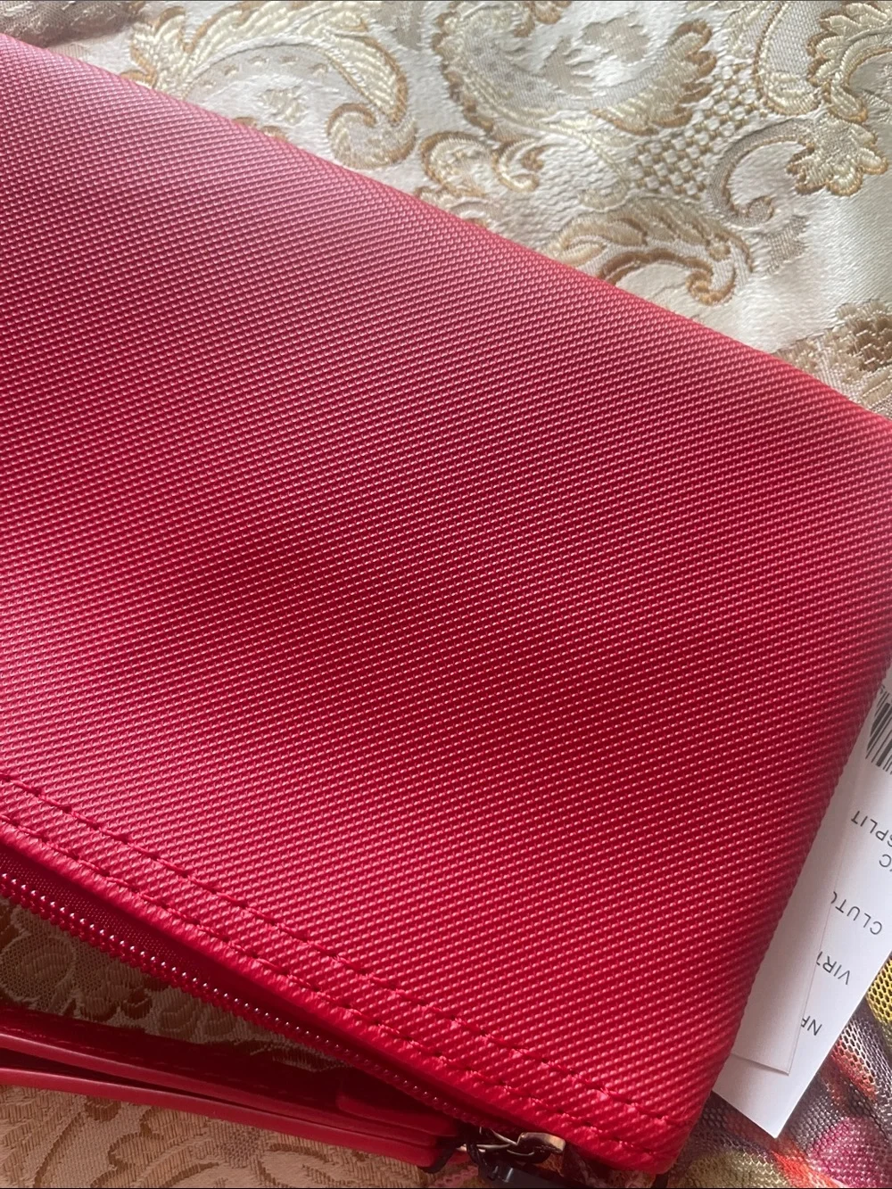 Lacoste compact wristlet