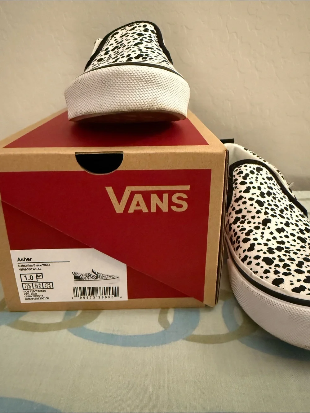 Vans Kids Slip-On Sneakers in White with Black Spot Print