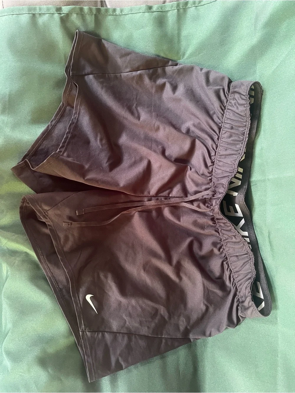 Nike Women's Athletic Shorts in Dark Brown with White Swoosh