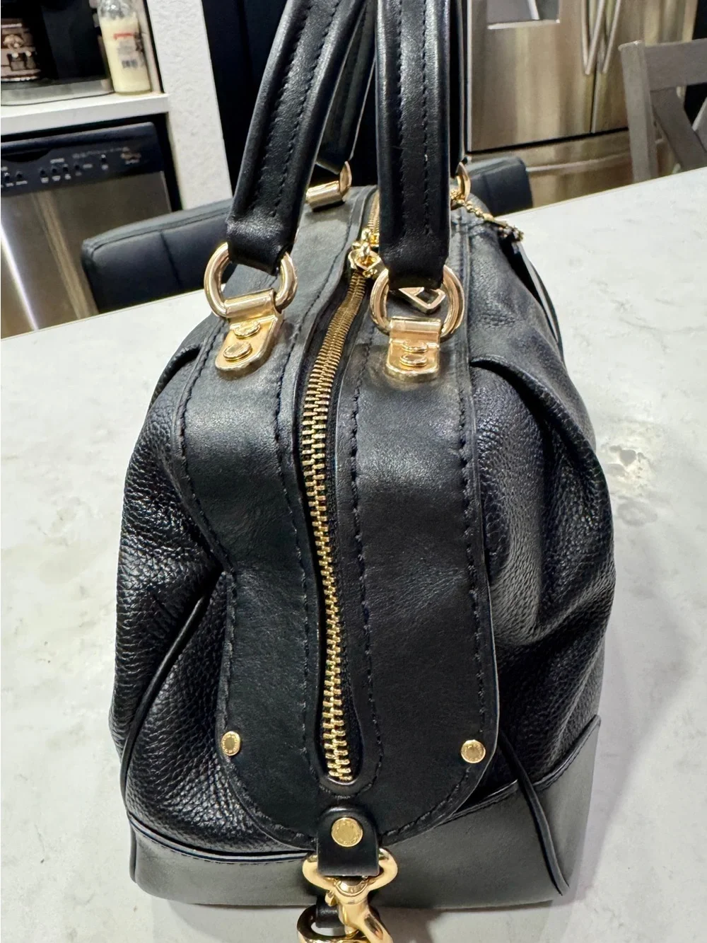 Coach polished pebble