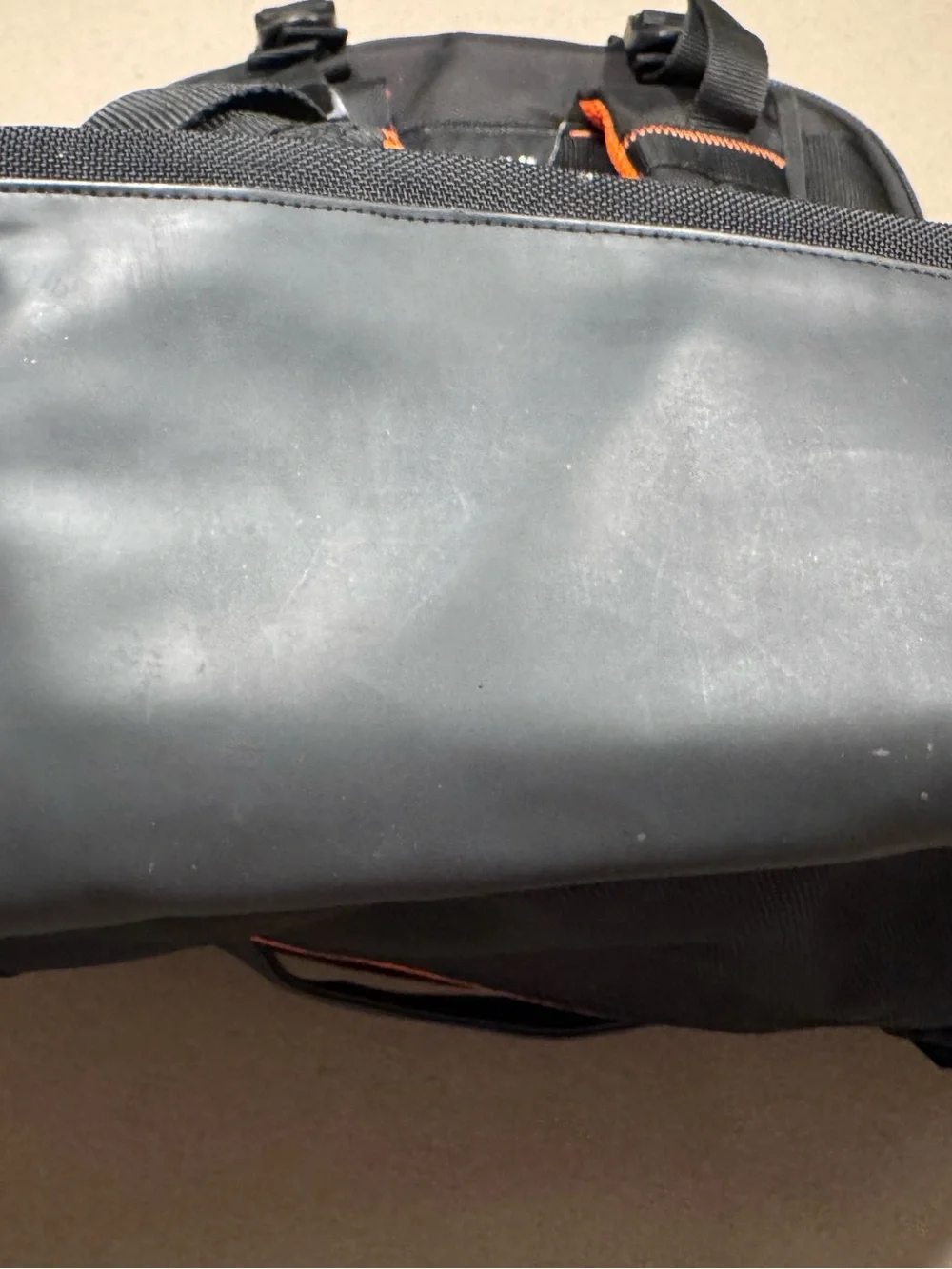 Black Men's Travel Backpack with Orange Accents Everki large laptop bag.