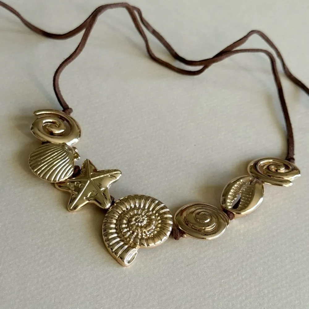 Anthropologie elegant gold