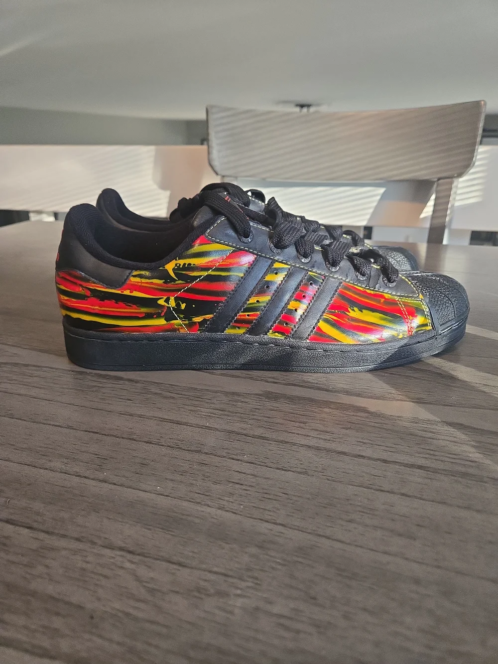 Adidas Black Superstar Sneakers with Red & Yellow Graphic