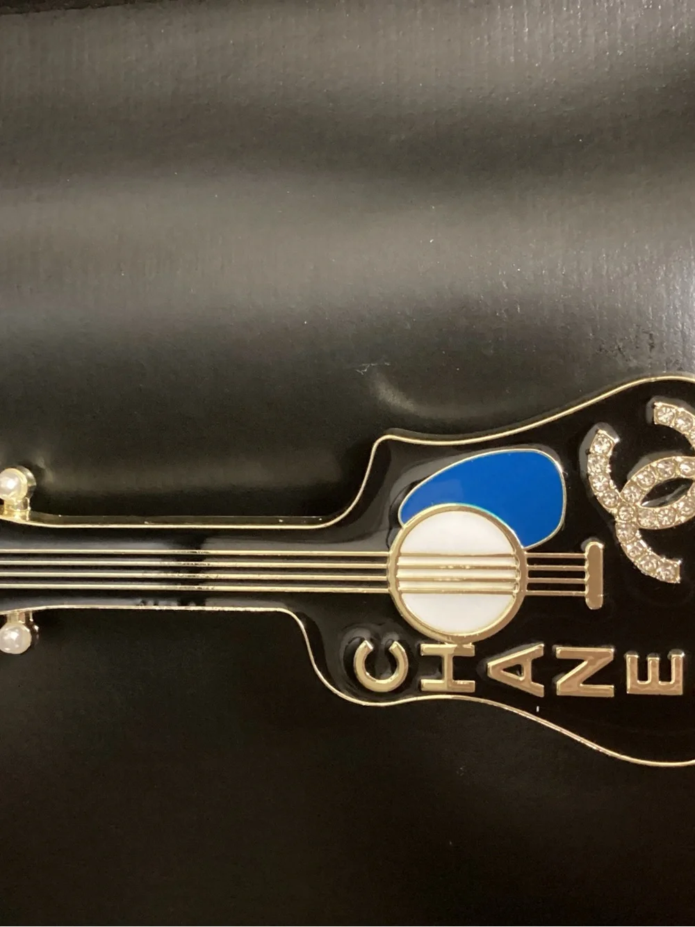 CHANEL guitar shaped