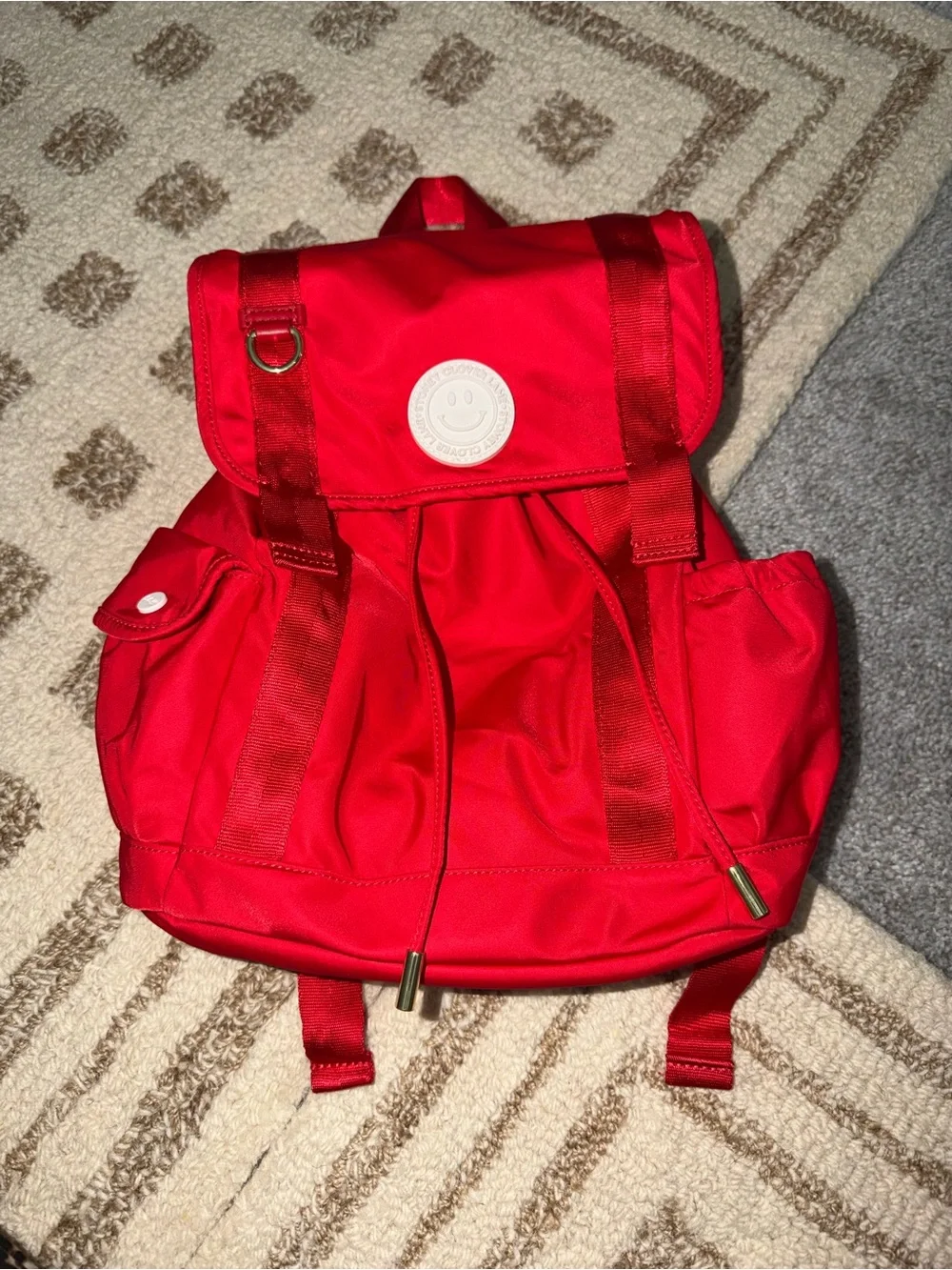 Stony Clover Lane Red Smiley Patch Drawstring Backpack