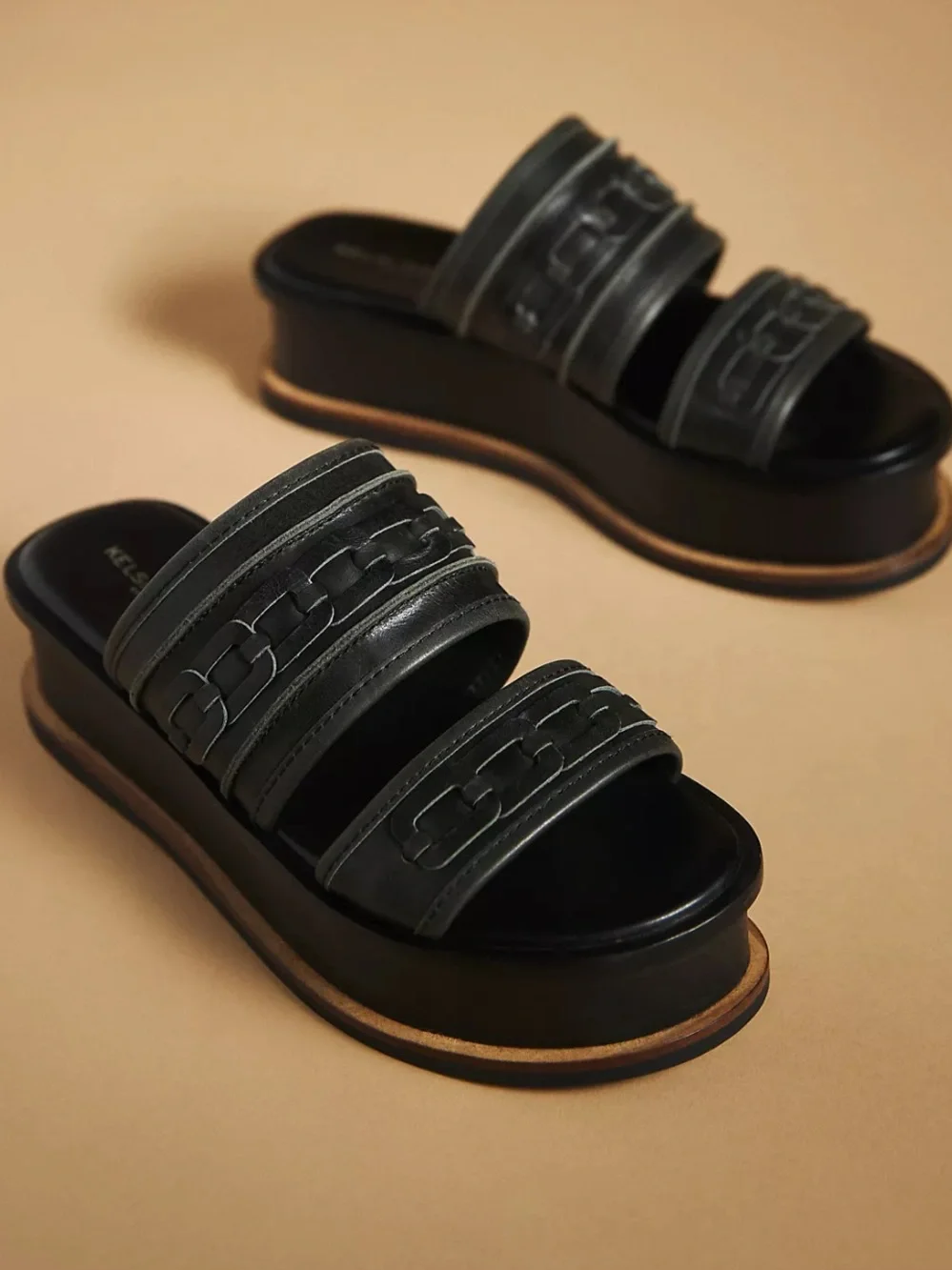 Kelsi Dagger Brooklyn Drift platform slide sandals in black leather featuring 7