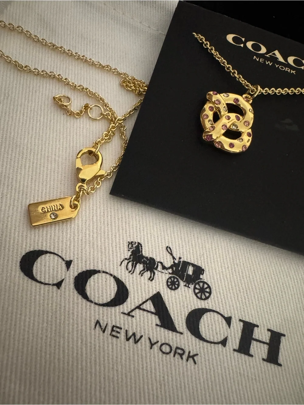 Coach gold tone