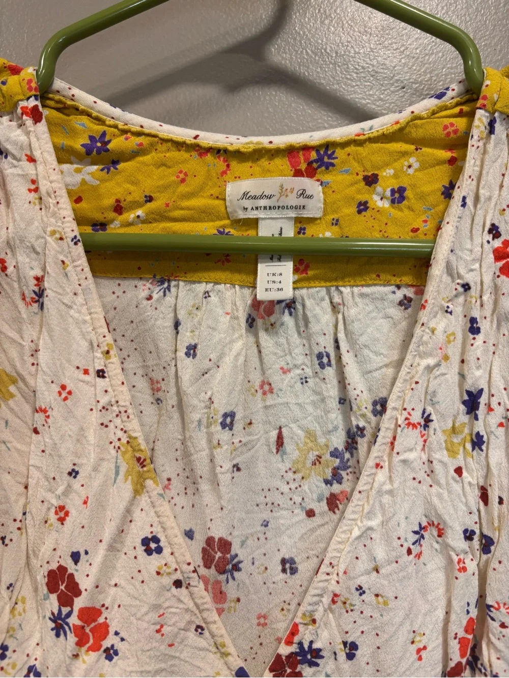 Anthropologie White Floral Wrap Top with Mustard Puff Sleeves