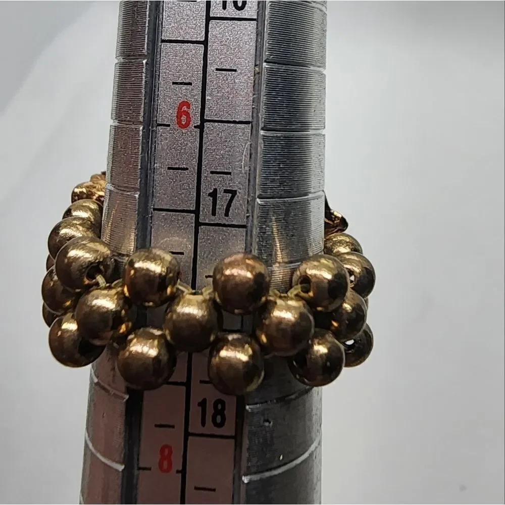 Roman gold tone