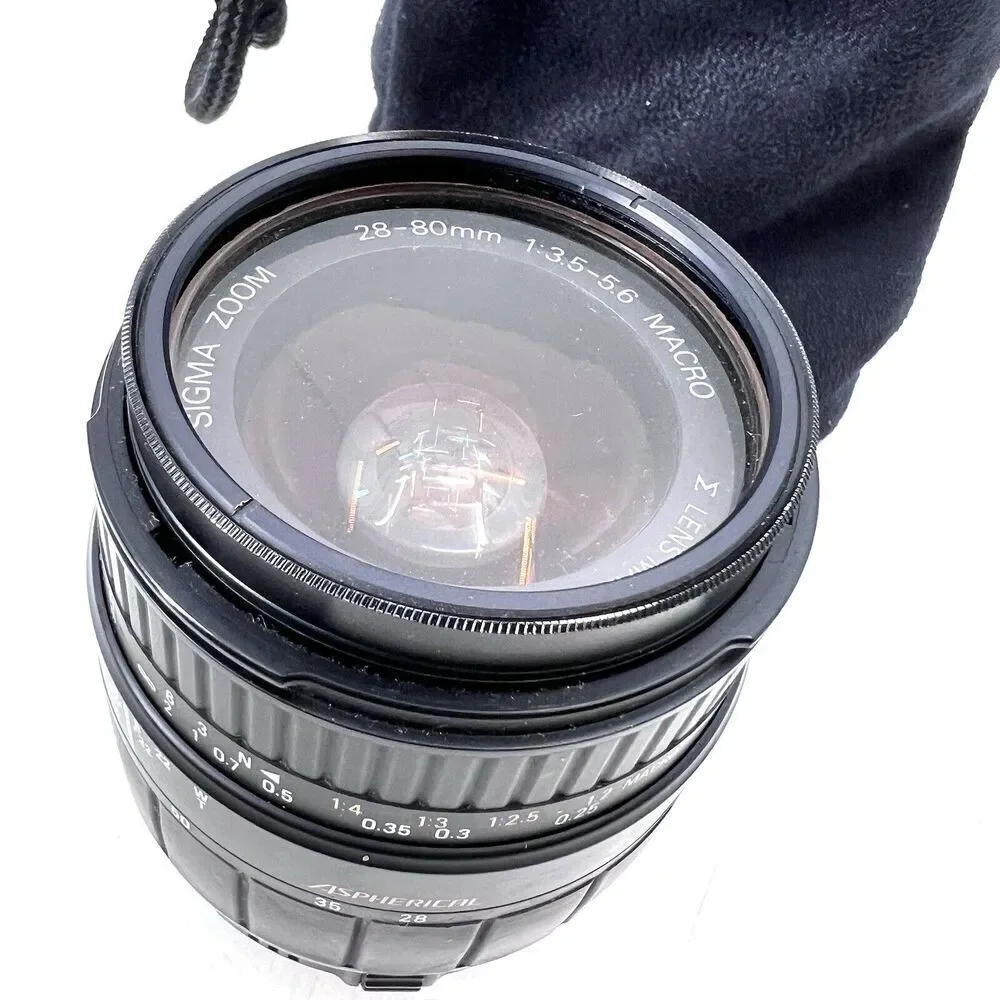 Sigma 28-80f/3.5-5.6 Aspherical Macro Lens w/a Tiffen Sky 1A Filter & Carry Bag