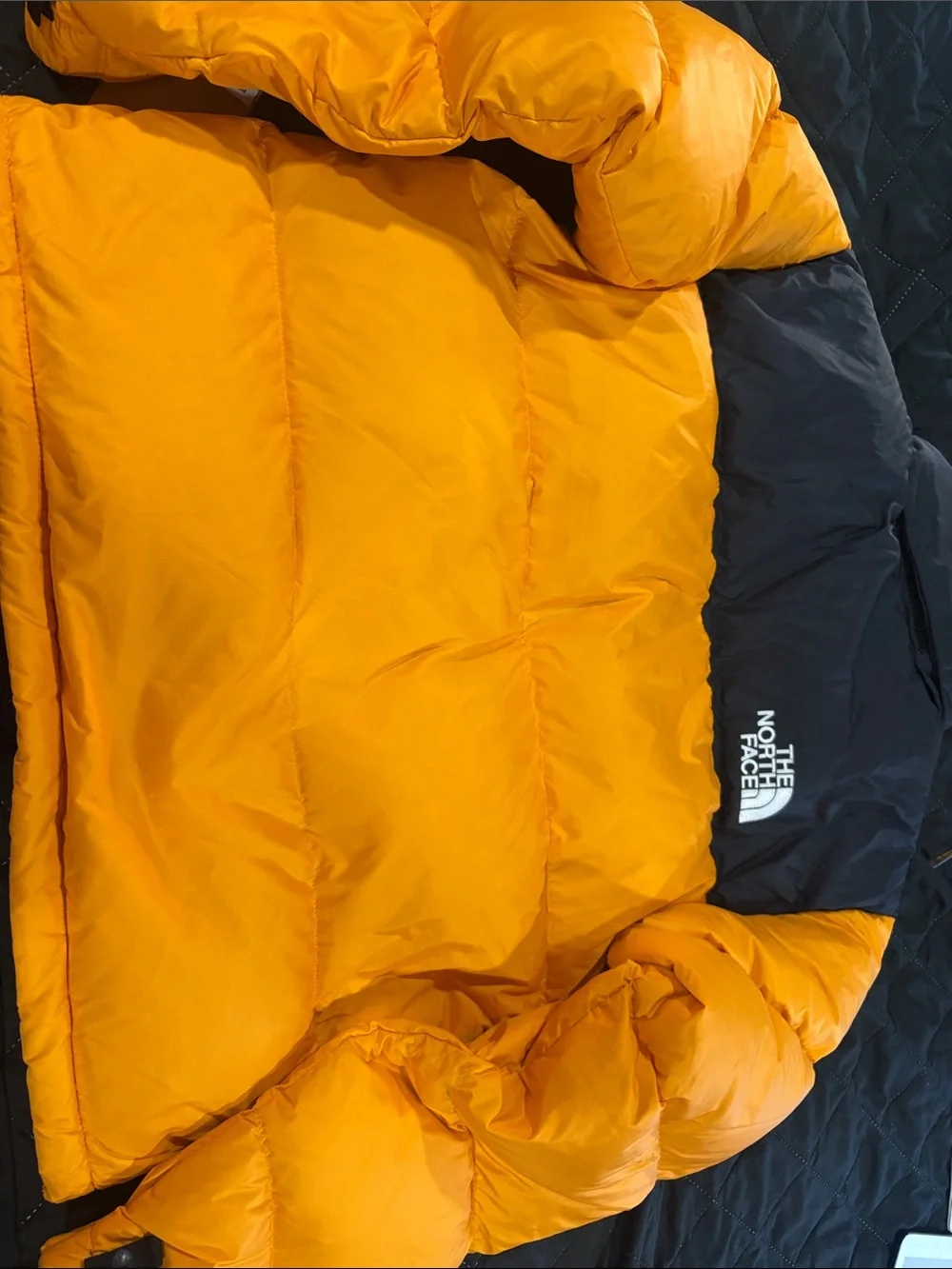 The North Face Men’s Orange and Black Puffer Jacket