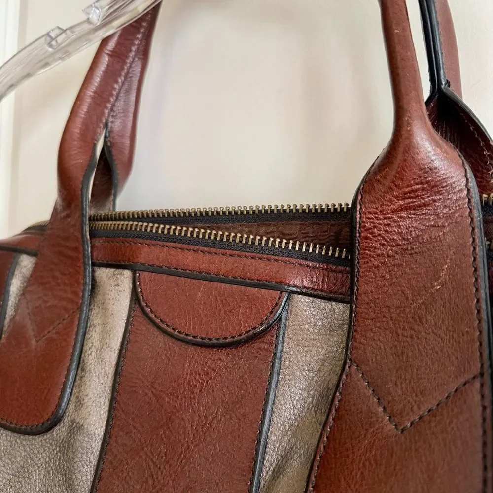 Fossil satchel combines