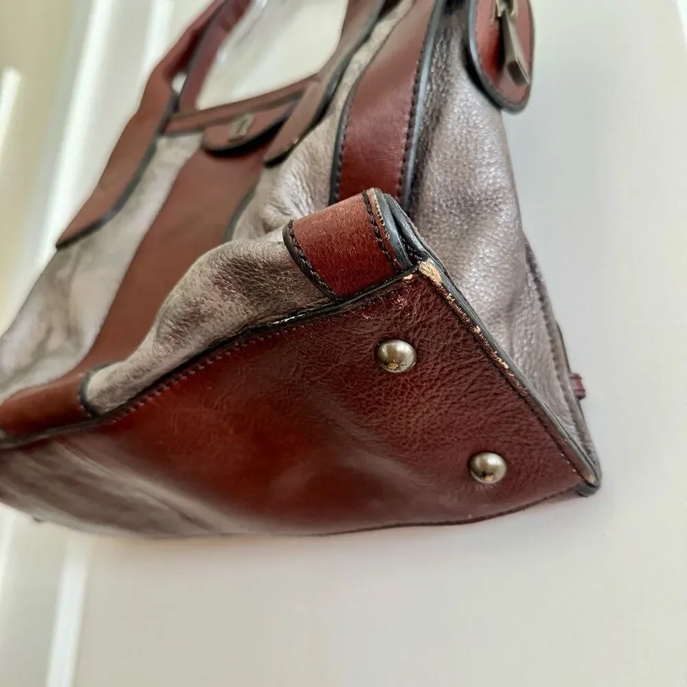 Fossil satchel combines