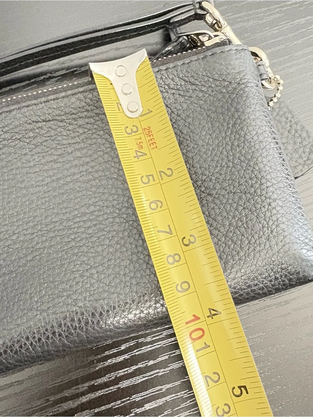Coach wrist hardware compartments