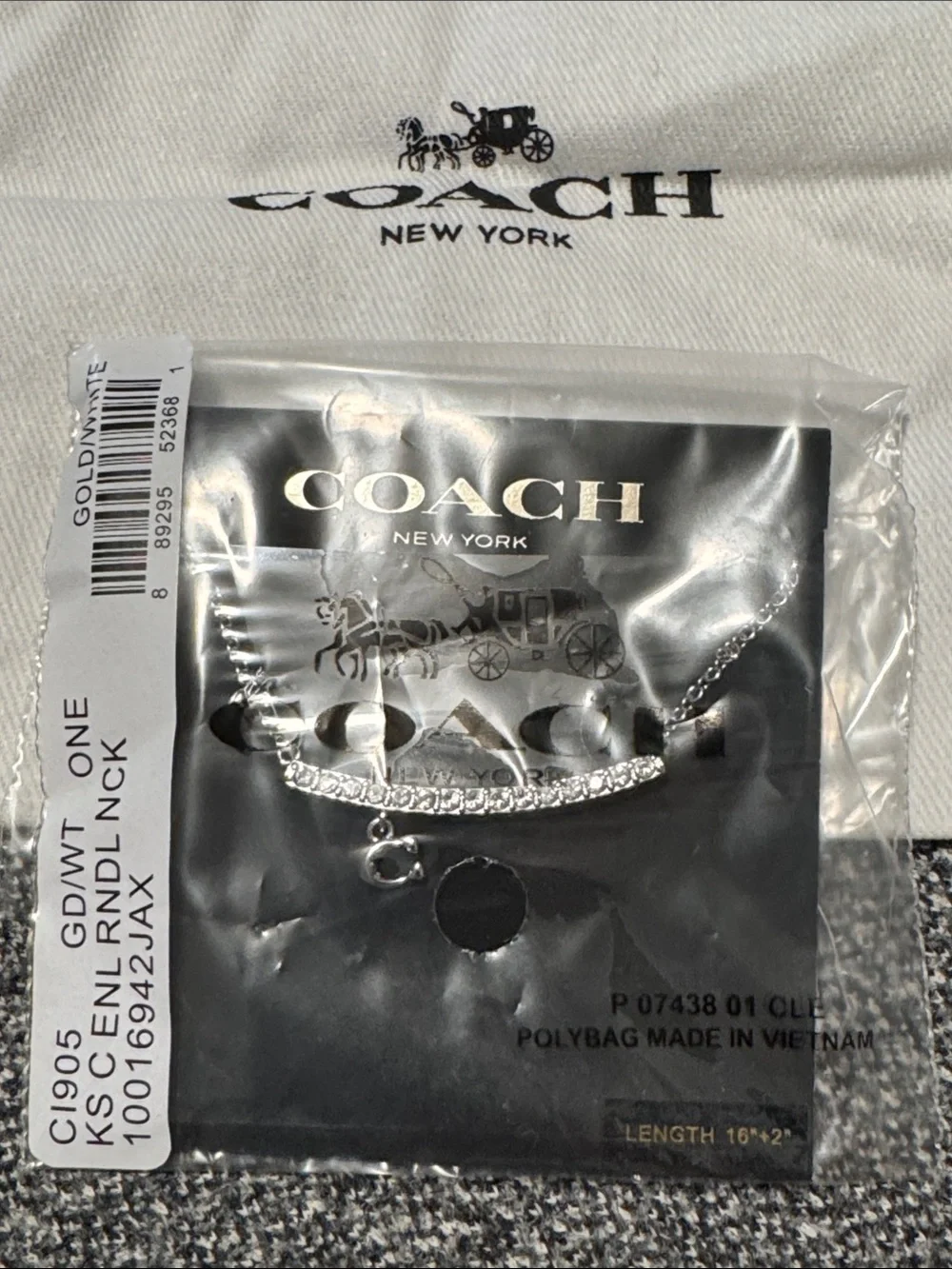 Coach branded silver