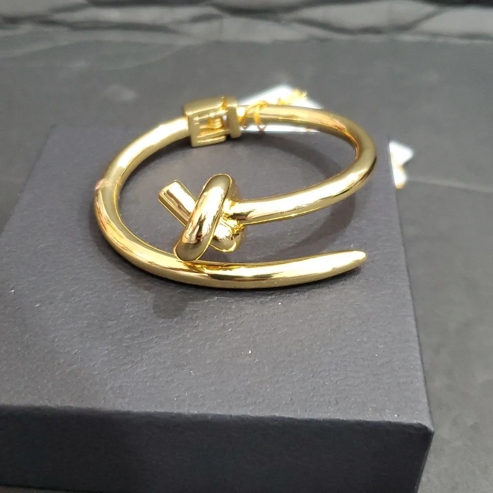 Eye Candy gold tone knot and point open‎ cuff hinged bracelet bangle brand new