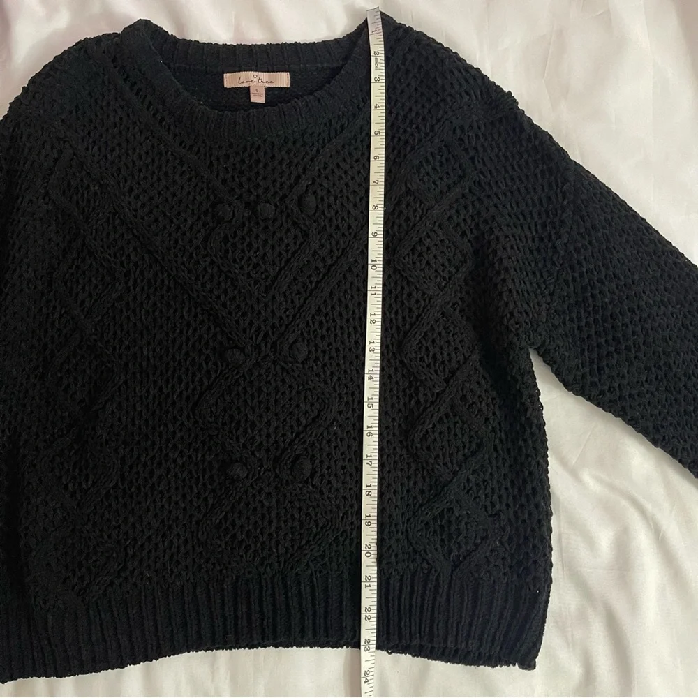 Black crew neck dropped shoulders ribbed trims knit sweater